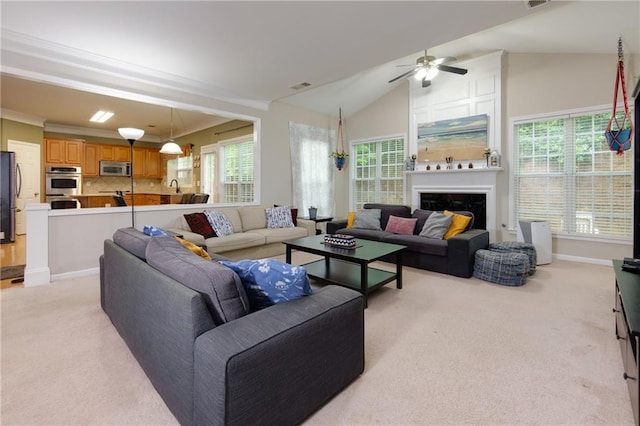 118 Brendylynn Trce, Woodstock, GA 30188 - living room with light colored carpet, ceiling fan, baseboards, a large fireplace, and vaulted ceiling