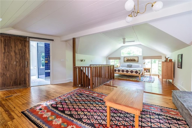 bedroom with hardwood / wood-style floors, access to outside, lofted ceiling, and baseboards