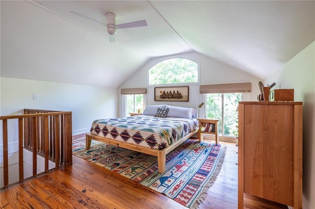 bedroom featuring vaulted ceiling, wood finished floors, and a ceiling fan