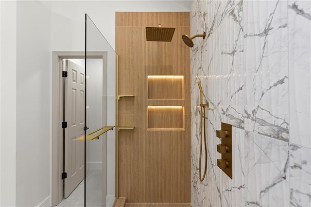 full bathroom with a marble finish shower