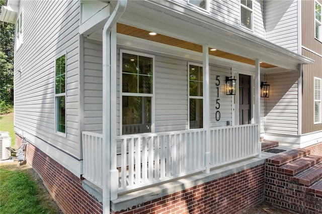 property entrance featuring covered porch