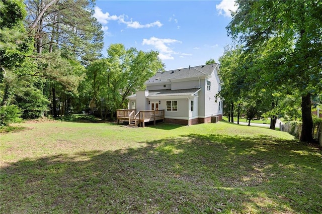 rear view of property with a wooden deck