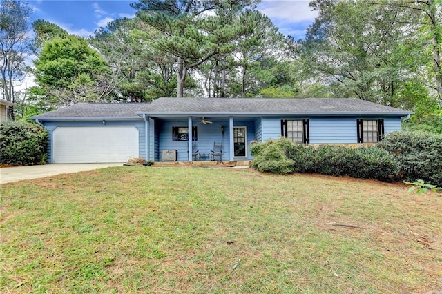 single story home with a garage, a front lawn, and covered porch