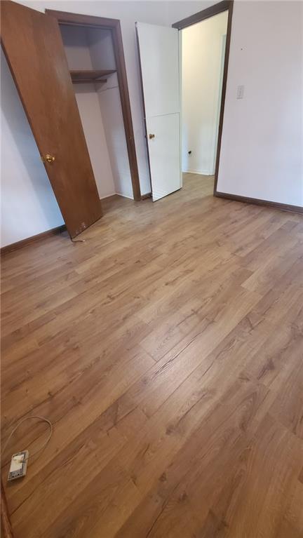 unfurnished bedroom with light hardwood / wood-style floors