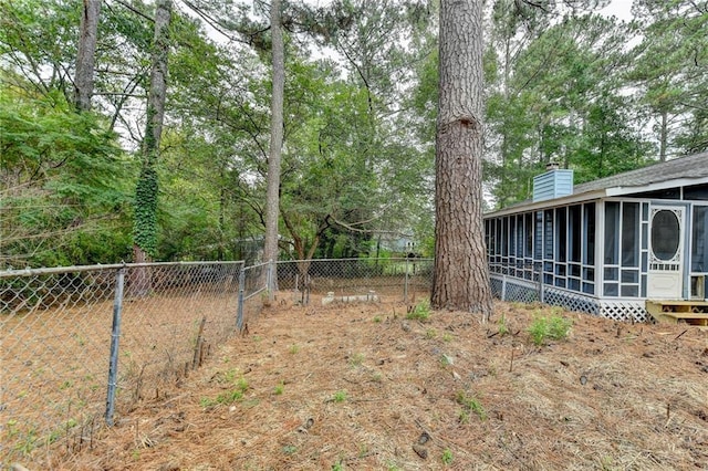 view of yard with a sunroom