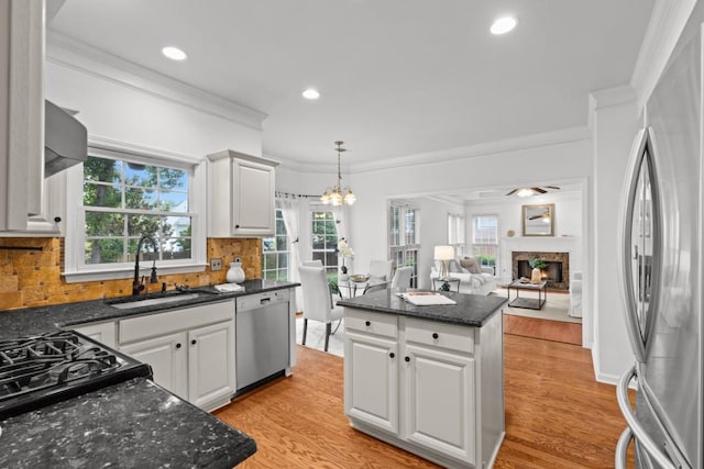 3242 Monarch Pine Dr, Peachtree Corners, GA 30071 - kitchen featuring stainless steel appliances, ornamental molding, a sink, white cabinets, and decorative backsplash