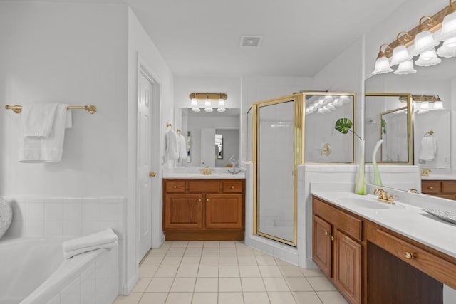 3242 Monarch Pine Dr, Peachtree Corners, GA 30071 - full bathroom featuring a stall shower, tile patterned floors, two vanities, and a garden tub