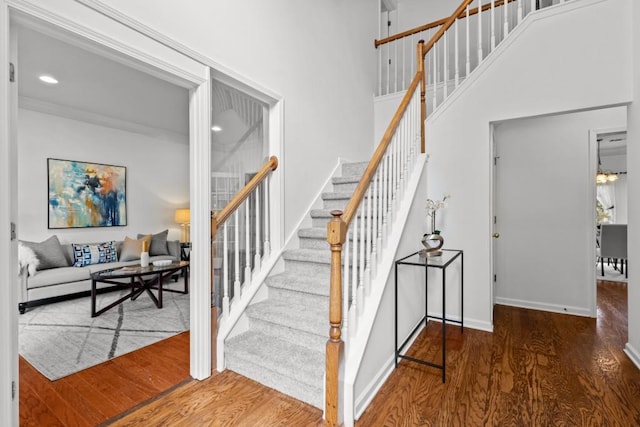 3242 Monarch Pine Dr, Peachtree Corners, GA 30071 - staircase with wood finished floors, baseboards, recessed lighting, and a towering ceiling
