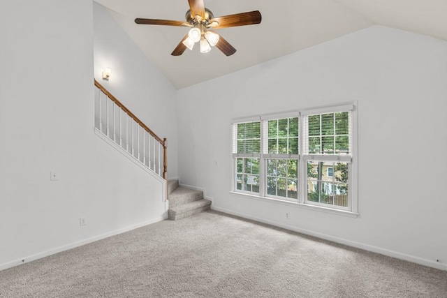 3242 Monarch Pine Dr, Peachtree Corners, GA 30071 - unfurnished living room with lofted ceiling, carpet flooring, stairs, ceiling fan, and baseboards