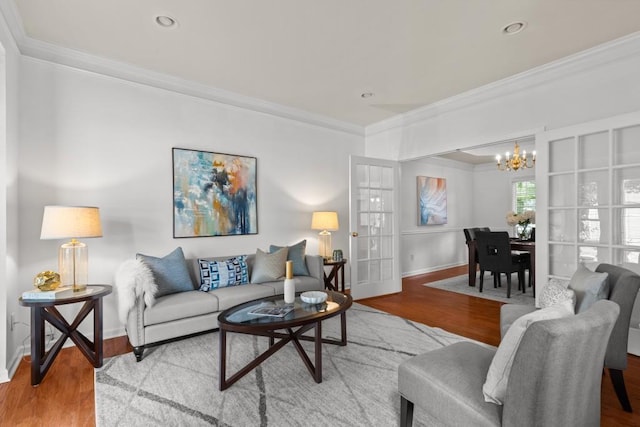 3242 Monarch Pine Dr, Peachtree Corners, GA 30071 - living room featuring ornamental molding, a chandelier, baseboards, and wood finished floors