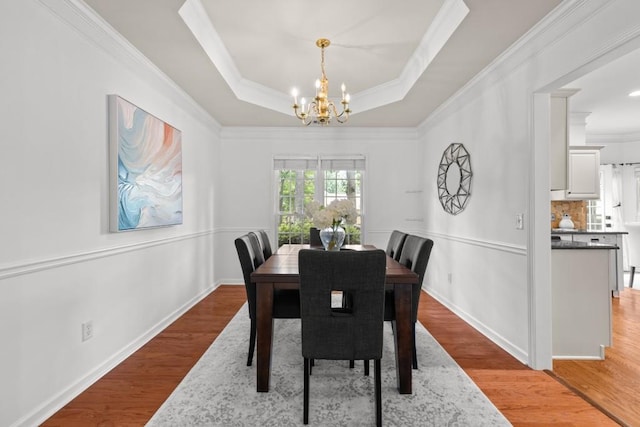 3242 Monarch Pine Dr, Peachtree Corners, GA 30071 - dining room featuring ornamental molding, a chandelier, and wood finished floors