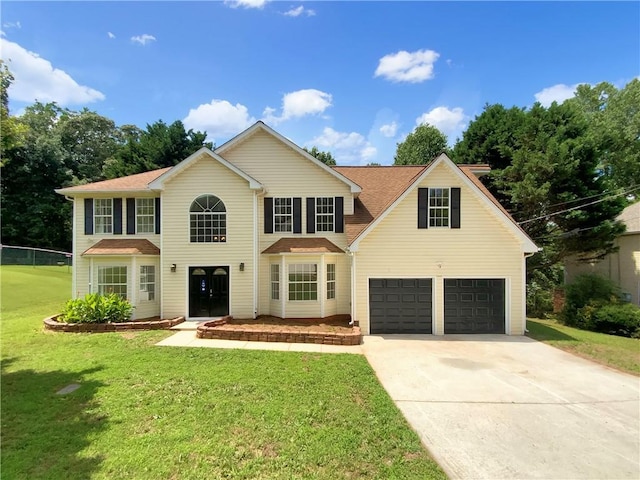 5159 Round Table Dr, Ellenwood, GA 30294 - view of front facade with an attached garage, driveway, and a front yard