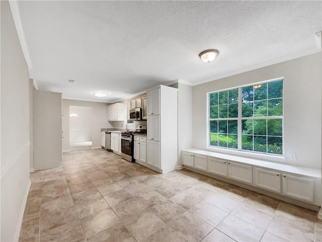5159 Round Table Dr, Ellenwood, GA 30294 - kitchen featuring stainless steel appliances, crown molding, white cabinets, and a textured ceiling