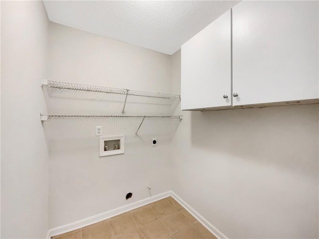 5159 Round Table Dr, Ellenwood, GA 30294 - washroom with electric dryer hookup, washer hookup, cabinet space, light tile patterned flooring, and gas dryer hookup