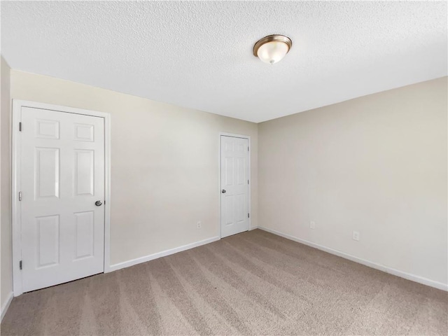 5159 Round Table Dr, Ellenwood, GA 30294 - empty room with carpet flooring and a textured ceiling