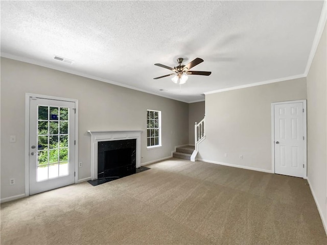 5159 Round Table Dr, Ellenwood, GA 30294 - unfurnished living room with stairway, carpet flooring, a ceiling fan, ornamental molding, and a fireplace