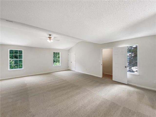 5159 Round Table Dr, Ellenwood, GA 30294 - unfurnished room featuring ceiling fan, a textured ceiling, carpet floors, and vaulted ceiling