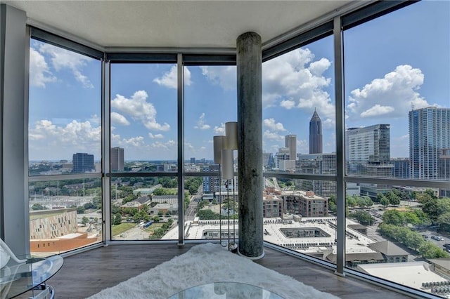 285 Centennial Olympic Park Dr NW Unit 1905, Atlanta, GA 30339 - sunroom / solarium featuring a view of skyline and healthy amount of natural light