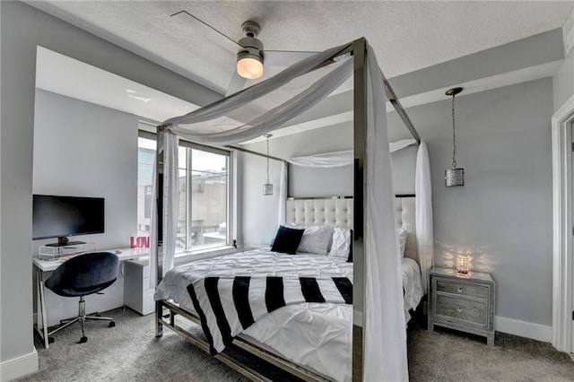 285 Centennial Olympic Park Dr NW Unit 1905, Atlanta, GA 30339 - bedroom with carpet flooring, a desk, a textured ceiling, and a ceiling fan