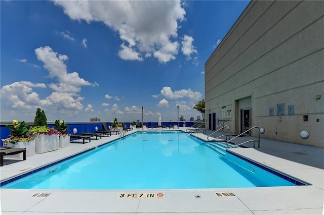 285 Centennial Olympic Park Dr NW Unit 1905, Atlanta, GA 30339 - community pool featuring a patio