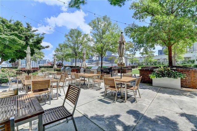 285 Centennial Olympic Park Dr NW Unit 1905, Atlanta, GA 30339 - view of patio / terrace with outdoor dining space and an outdoor kitchen