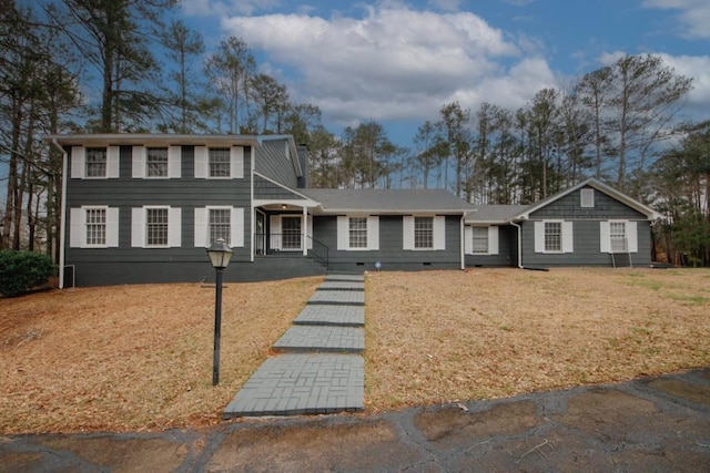 view of front facade with crawl space and a front yard