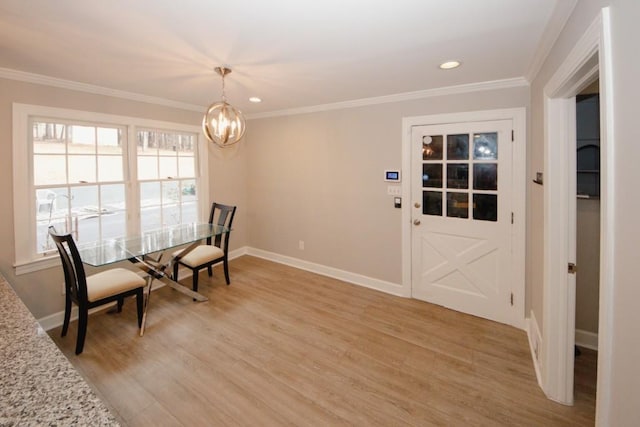 unfurnished room with light wood-style floors, baseboards, and ornamental molding