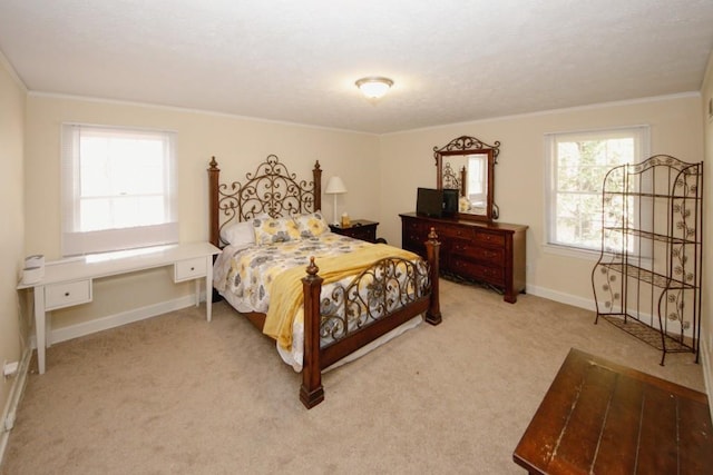 bedroom featuring light carpet, ornamental molding, and baseboards