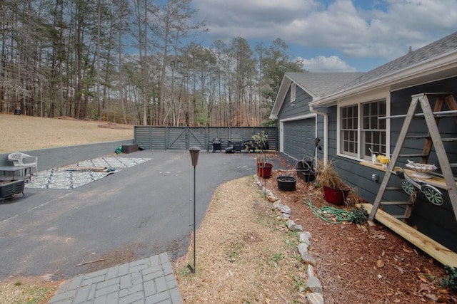 exterior space with a garage and fence