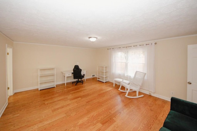 unfurnished room featuring light wood-type flooring and baseboards