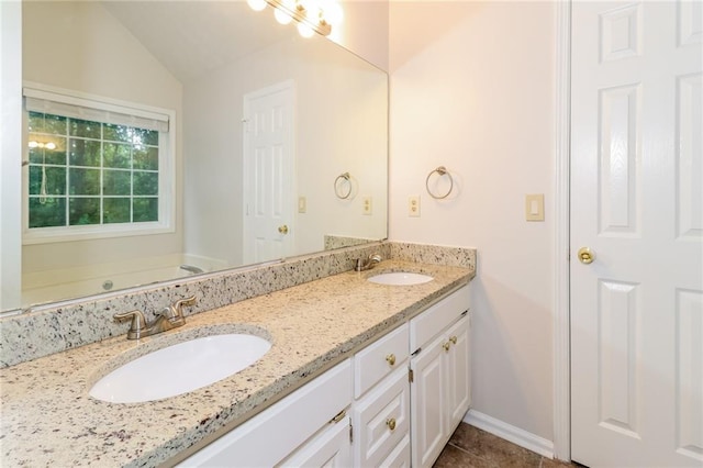 5526 Chestnut Creek Ln, Flowery Branch, GA 30542 - full bathroom with a sink, tile patterned flooring, vaulted ceiling, and double vanity