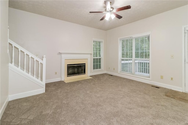 5526 Chestnut Creek Ln, Flowery Branch, GA 30542 - unfurnished living room with carpet floors, ceiling fan, and visible vents