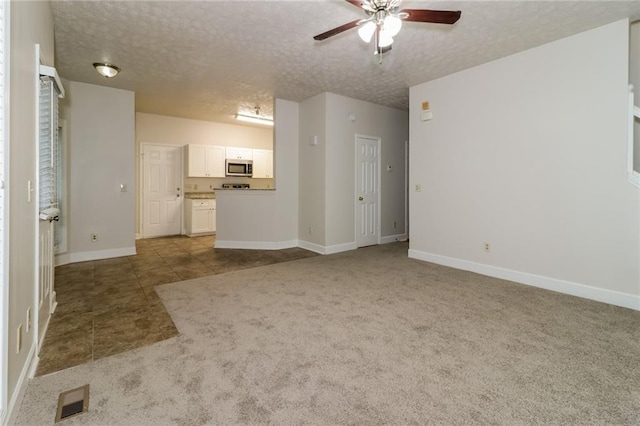 5526 Chestnut Creek Ln, Flowery Branch, GA 30542 - unfurnished living room featuring visible vents, a ceiling fan, a textured ceiling, and carpet flooring