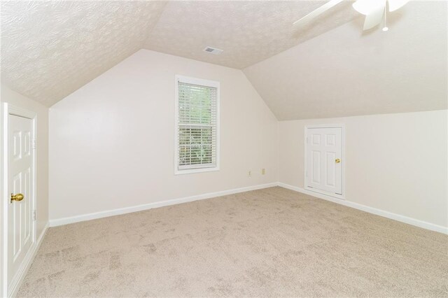5526 Chestnut Creek Ln, Flowery Branch, GA 30542 - bonus room featuring vaulted ceiling, carpet flooring, a textured ceiling, and visible vents