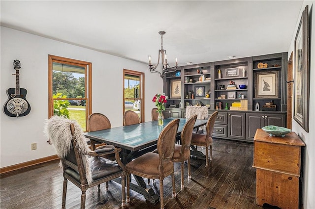 2452 Camp Mitchell Rd, Grayson, GA 30017 - dining space featuring a chandelier, dark wood-type flooring, and baseboards