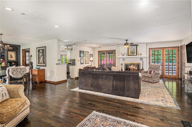 2452 Camp Mitchell Rd, Grayson, GA 30017 - living room with a ceiling fan, healthy amount of natural light, recessed lighting, a brick fireplace, and wood finished floors