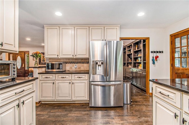 2452 Camp Mitchell Rd, Grayson, GA 30017 - kitchen featuring appliances with stainless steel finishes, dark wood finished floors, decorative backsplash, and recessed lighting