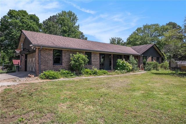 2452 Camp Mitchell Rd, Grayson, GA 30017 - single story home with brick siding, a front lawn, a garage, asphalt driveway, and roof with shingles