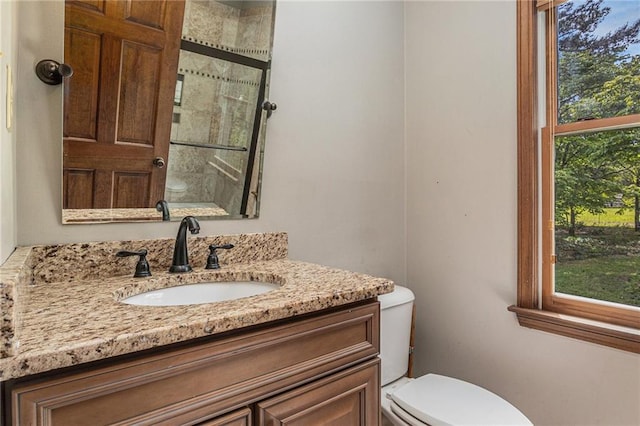 2452 Camp Mitchell Rd, Grayson, GA 30017 - bathroom with toilet, vanity, and tiled shower