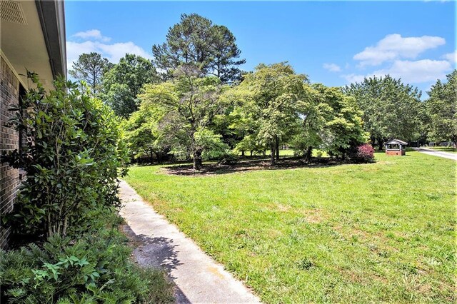 2452 Camp Mitchell Rd, Grayson, GA 30017 - bedroom featuring a barn door, carpet flooring, a textured ceiling, and recessed lighting