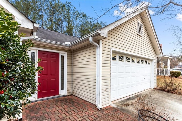 exterior space featuring driveway and an attached garage