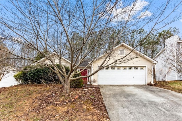 view of front of home featuring a garage and driveway