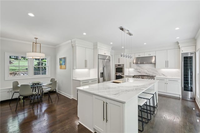 4152 Club Dr NE, Atlanta, GA 30319 - kitchen featuring white cabinets, a sink, under cabinet range hood, beverage cooler, and appliances with stainless steel finishes