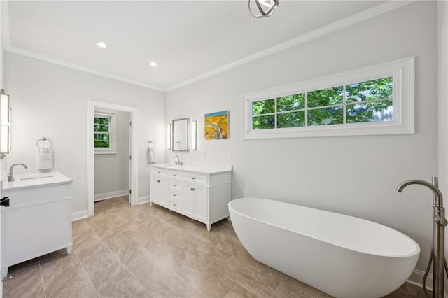 4152 Club Dr NE, Atlanta, GA 30319 - bathroom with a freestanding bath, two vanities, ornamental molding, and a sink
