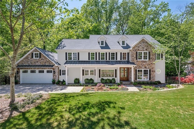 4152 Club Dr NE, Atlanta, GA 30319 - view of front facade with a front lawn, a standing seam roof, stone siding, an attached garage, and decorative driveway