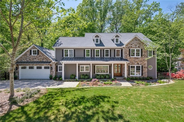 4152 Club Dr NE, Atlanta, GA 30319 - view of front of house featuring a standing seam roof, driveway, stone siding, an attached garage, and a front yard