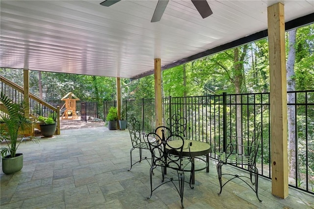 4152 Club Dr NE, Atlanta, GA 30319 - view of patio featuring a playground, ceiling fan, and fence