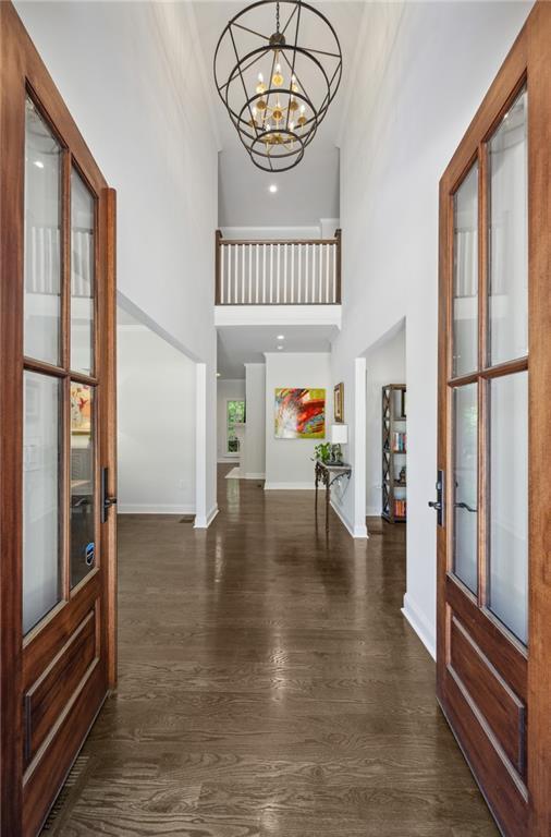4152 Club Dr NE, Atlanta, GA 30319 - entrance foyer featuring recessed lighting, a high ceiling, baseboards, a chandelier, and dark wood-style flooring
