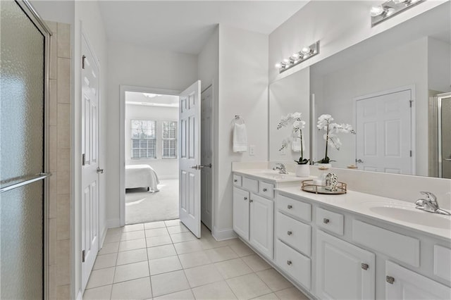 bathroom with tile patterned floors, vanity, and walk in shower