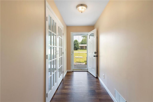 entryway with baseboards, french doors, dark wood-style floors, and visible vents